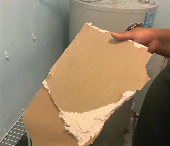 A piece of detached drywall.
