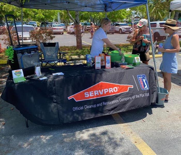 Booth with a black SERVPRO table cloth.
